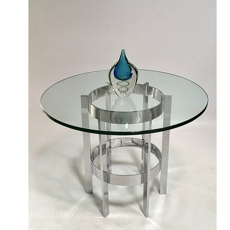  20th Century Decorative Arts |Merrow Associates c1970's - A chrome and glass circular dining table featuring a superb quality chromed steel base supporting a round 19mm thick glass top.