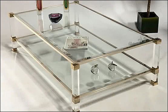 ☑️ 20th Century Decorative Arts |Pierre Vandel, Paris, 
A 22ct gold plated, lucite (perspex) and glass two tier coffee table c1970’s 