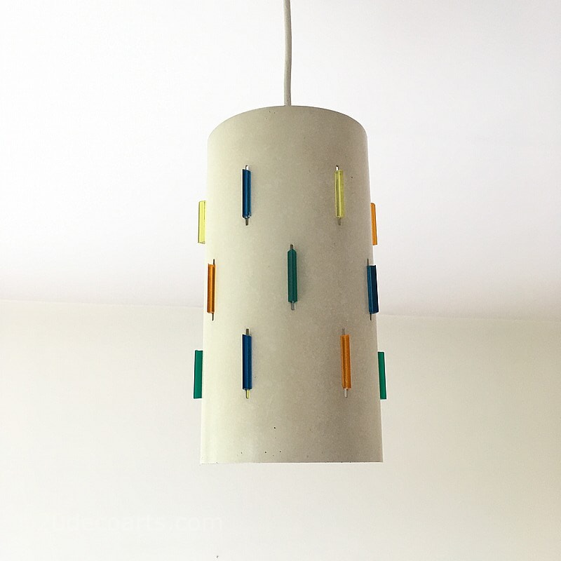  Rotaflex Interplay Light Shade designed by John & Sylvia Reid c1950s -
The metal cylinder with a matt white coating pierced with vertical slits containing coloured plastic jewels 