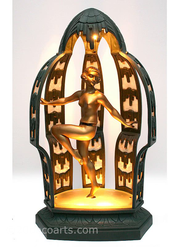  20th Century Decorative Arts | A wonderful and rare art deco spelter lamp, circa 1920's, France "Temple Dancer" by Limousin the gold painted metal figure mounted on an illuminated glass base within an extravagant illuminated dark green painted metal and pearlised celluloid paneled "temple"