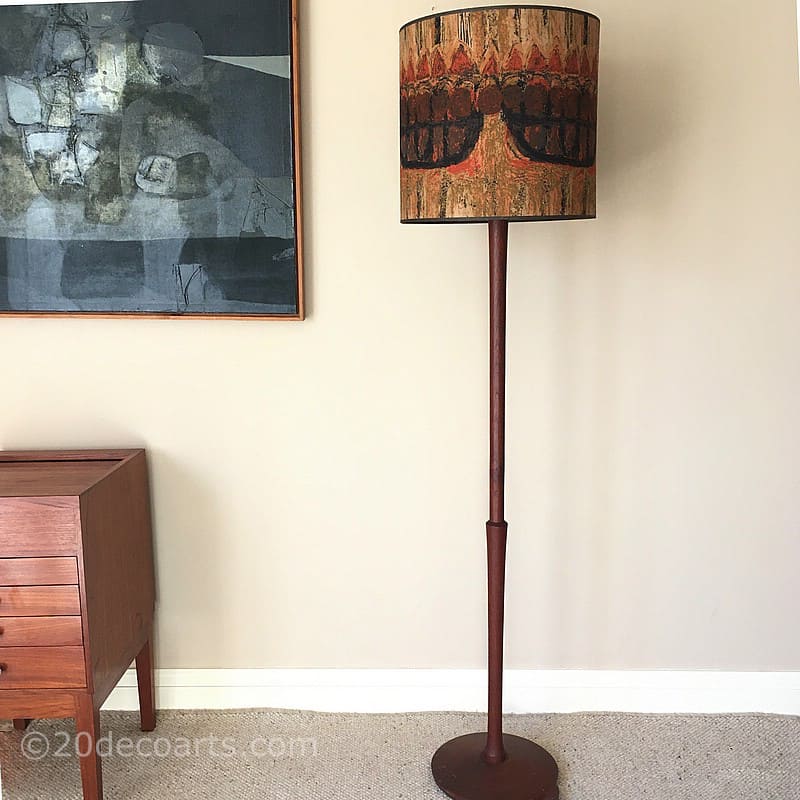  A Heals Mid Century Floor Lamp the solid teak standard lamp base supporting a cylindrical drum shade in Nicola Wood's “Armada” pattern fabric designed for Heals c1965 