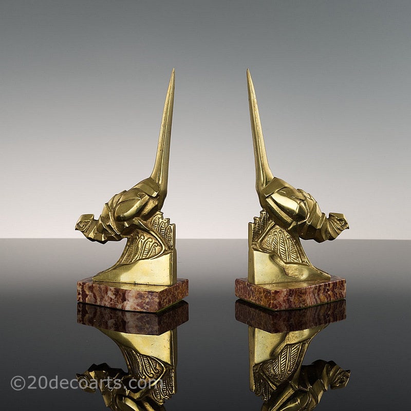  Irénée Rochard - A pair of Art Deco Bookends, France circa 1930, the polished bronze cubist style pheasants mounted on a rouge marble bases