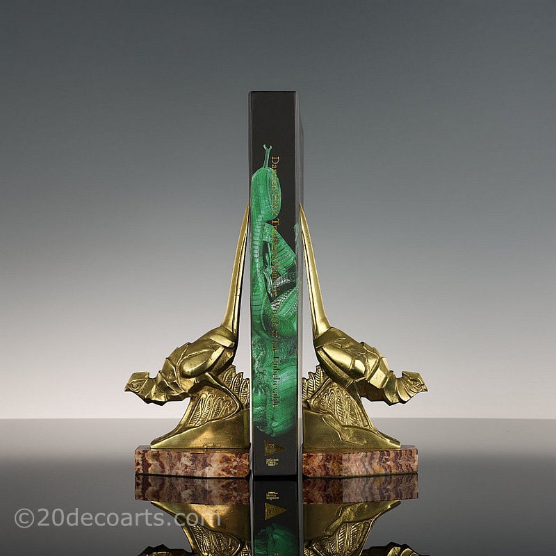  2Irénée Rochard - A pair of Art Deco Bookends, France circa 1930, the polished bronze cubist style pheasants mounted on a rouge marble bases