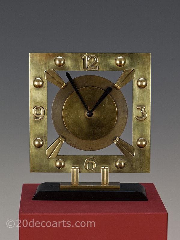 Modernist Art Deco Clock by Bayard, France circa 1930, made of bronze and brass, mounted on black marble.