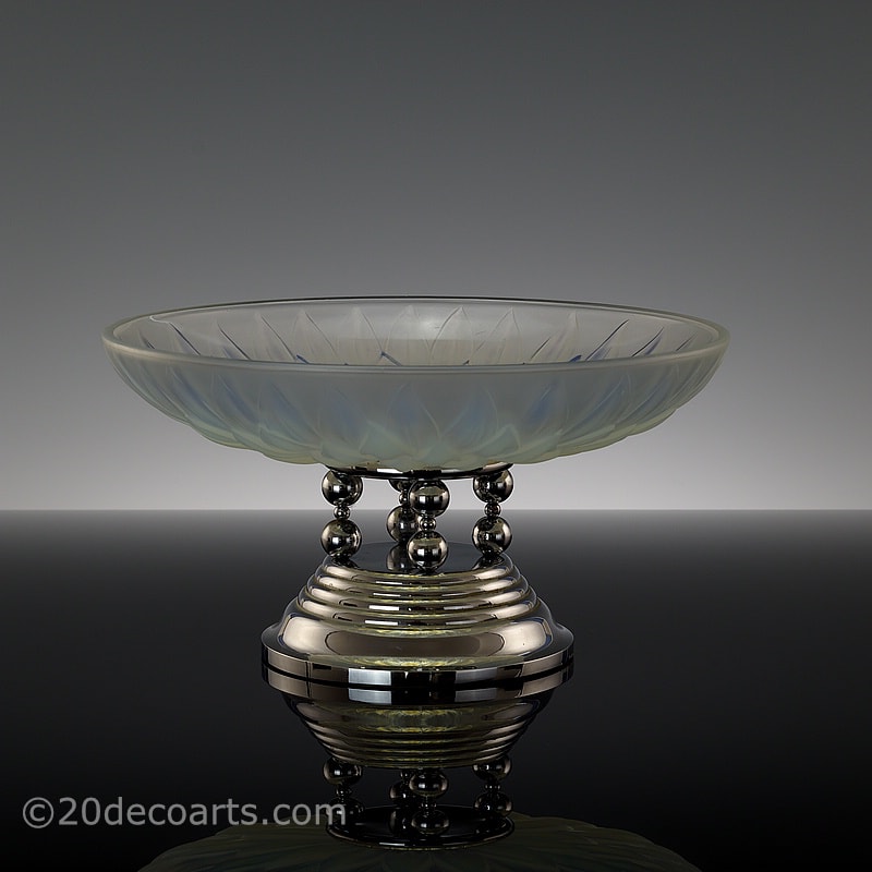  20th Century Decorative Arts |A stylish Art Deco opalescent glass table centrepiece, 1930s, by Etling of Paris, the satin and polished glass molded with a stylised flower head, mounted on a modernist chromed metal base