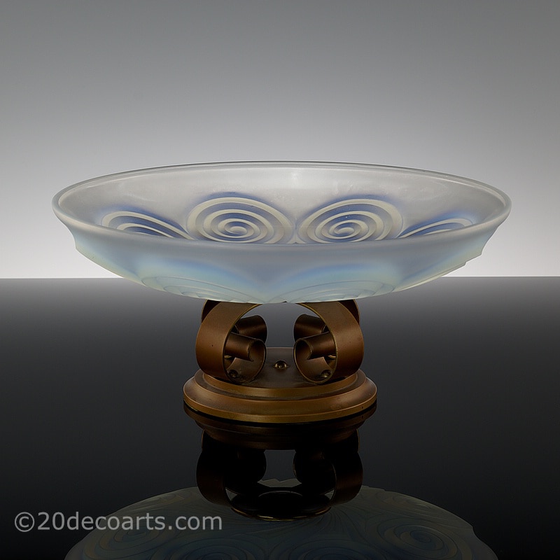  20th Century Decorative Arts |A beautiful Art Deco opalescent glass table centrepiece, 1930s, by Etling of Paris , the satin and polished glass molded with a stylised swirls, mounted on a patinated brass scroll design base