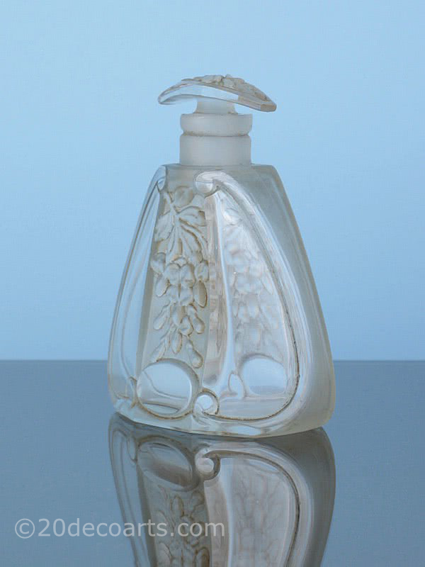  20th Century Decorative Arts |A lovely Art Deco molded glass scent bottle, the satin and polished glass molded with a stylised foliage, France 1920s