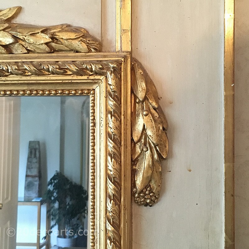  French Empire Style Trumeau Mirror, Early 20th century. The rectangular mirror set in a painted wood and parcel gilded plaster frame