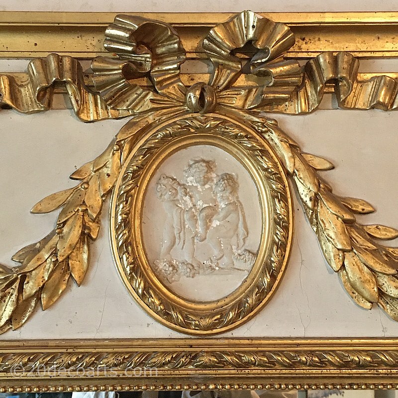  French Empire Style Trumeau Mirror, Early 20th century. The rectangular mirror set in a painted wood and parcel gilded plaster frames