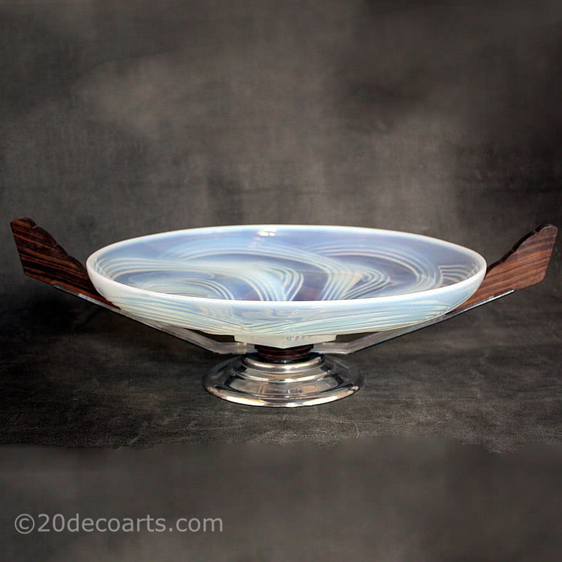  20th Century Decorative Arts |A beautiful Art Deco opalescent glass table centrepiece, 1930s, the glass probably by Cristallerie Choisy-le-Roi France, the polished glass molded with a stylised swirls, mounted on palisander wood and chromed metal