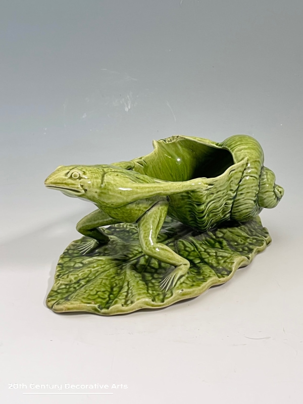  Watcombe Torquay Pottery Frog Spoon Warmer c1880 In the form of a frog on a lily pad / leaf pulling a shell glazed in green.  