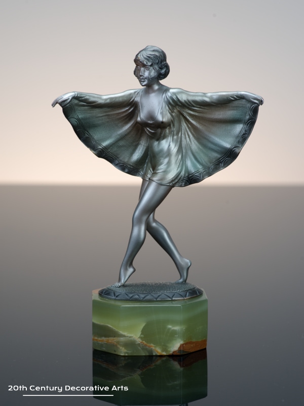   Otto Scheer - An Art Deco bronze figure circa 1930 - depicting a costumed young woman cold-painted silver   