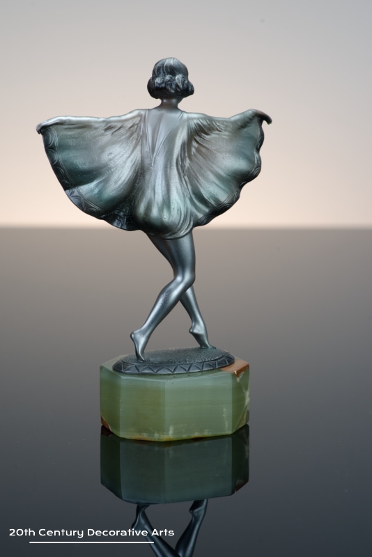  Otto Scheer - An Art Deco bronze figure circa 1930 - depicting a costumed young woman cold-painted silver