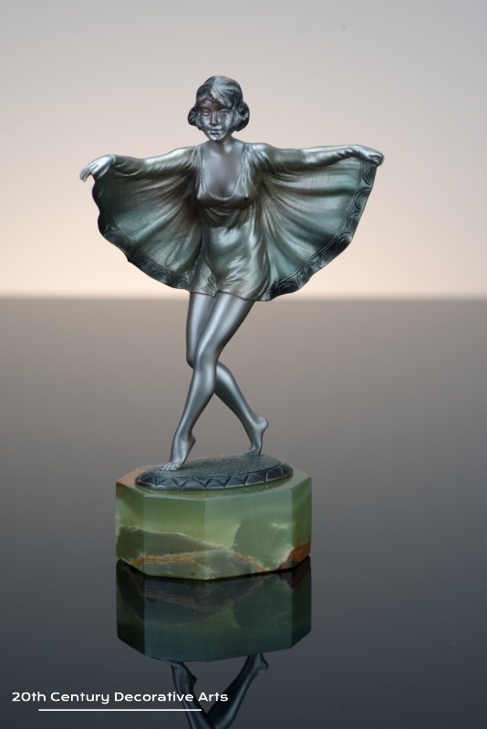   Otto Scheer - An Art Deco bronze figure circa 1930 - depicting a costumed young woman cold-painted silver 