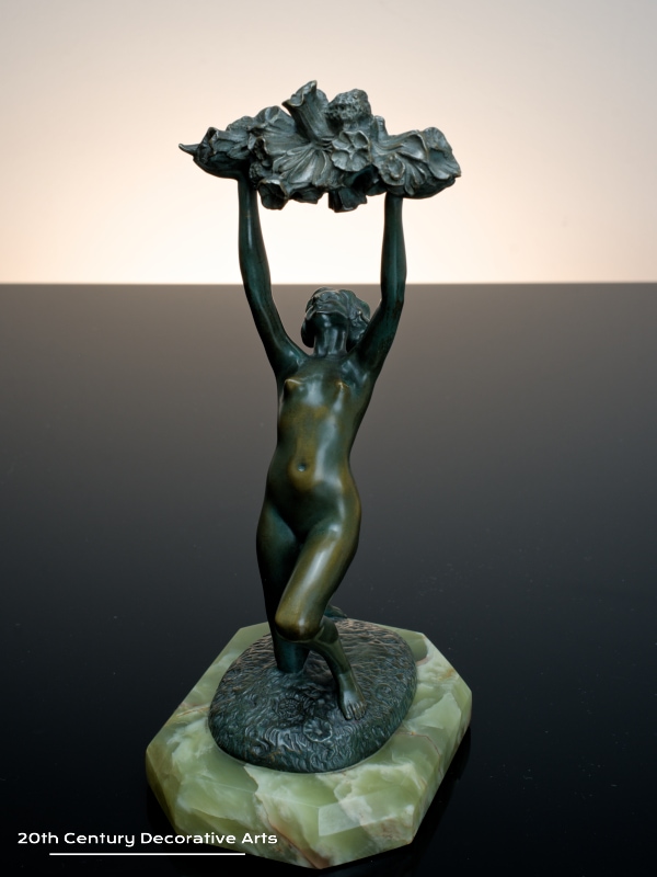   Art Deco bronze sculpture for sale circa 1930 the nude dancer holding aloft an abundance of flowers 