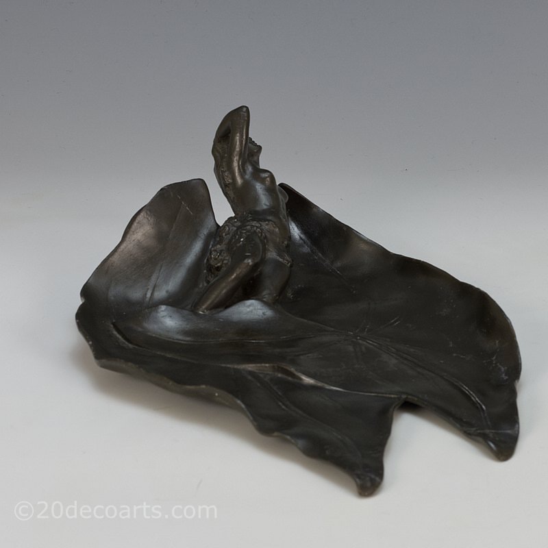 Art Nouveau pewter sculpture of a woman, France circa 1900 - formed as a vide poche with the young woman sleeping on large leaves 