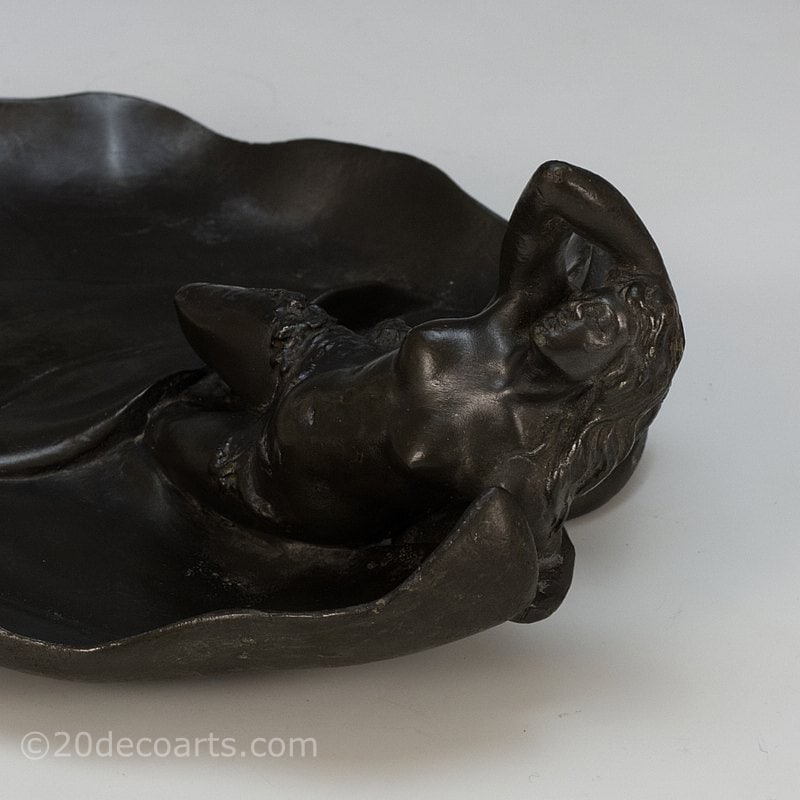  Art Nouveau pewter sculpture of a woman, France circa 1900 - formed as a vide poche with the young woman sleeping on large leaves 