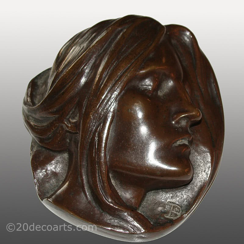  20th Century Decorative Arts |A rare Art Nouveau bronze sculptural paperweight, circa 1900, Paul Dubois, Belgium the patinated bronze featuring a sleeping female