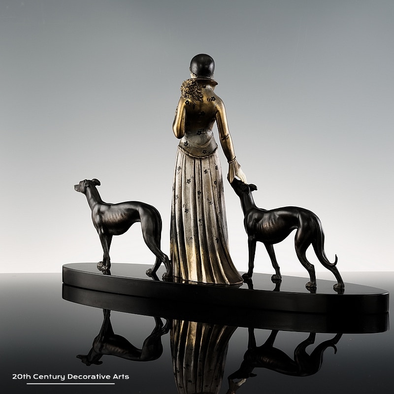 Demétre Chiparus - An Art Deco sculpture, France circa 1925 Maiden with Hounds, the young woman walking with her greyhounds