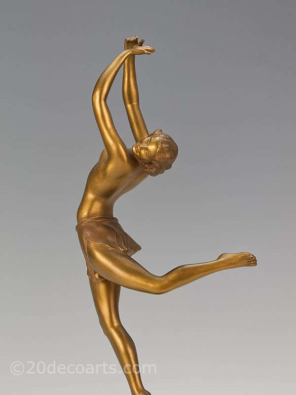  20th Century Decorative Arts |A stylish Art Deco spelter figure by Ugo Cipriani, with gold cold-painted and patinated finish, on a black marble base.