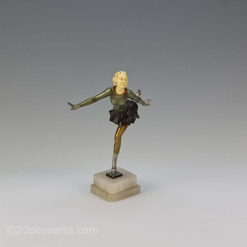 20th Century Decorative Arts |An Art Deco spelter and ivorine figure, Germany 1930s, the cold-painted figure mounted on a shaped alabaster base. 