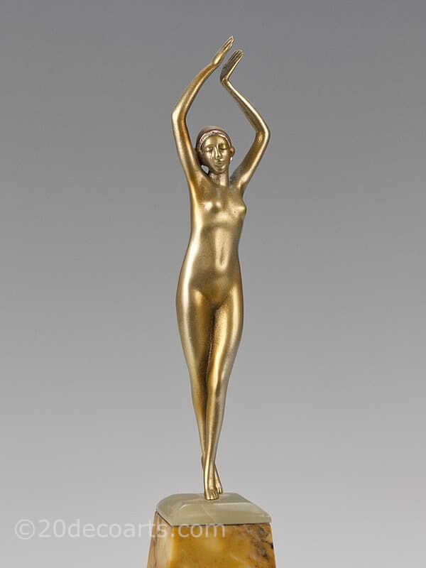  20th Century Decorative Arts | A stylised Art Deco bronze figure by Devriez, France circa 1920s depicting a dancer with a gold cold-painted and enamelled finish, mounted on tri-coloured marble base