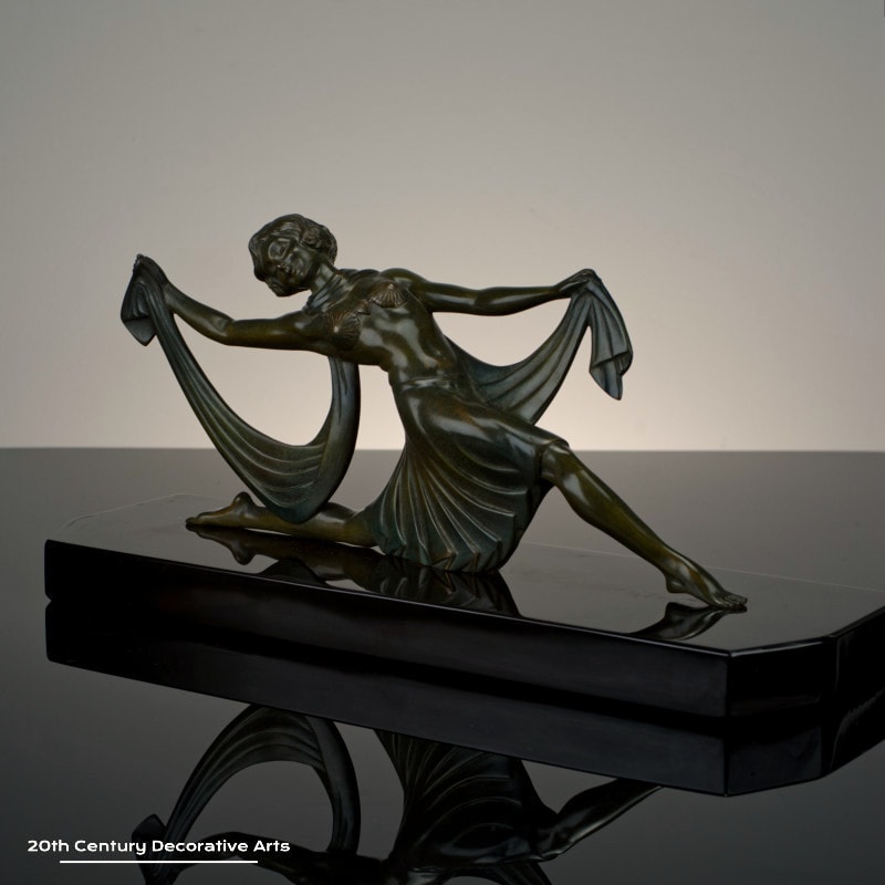  Jean Lormier - A French Art Deco bronze sculpture, circa 1925 - featuring a young woman in a dancing pose, the bronze with an antiqued patina