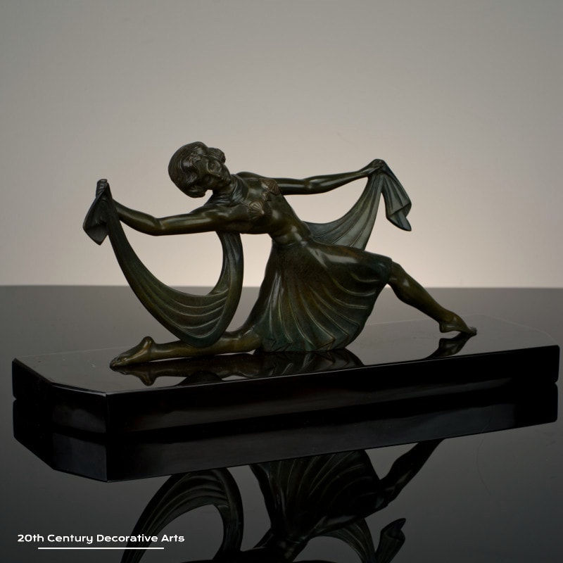 Jean Lormier - A French Art Deco bronze sculpture, circa 1925 - featuring a young woman in a dancing pose, the bronze with an antiqued patina.