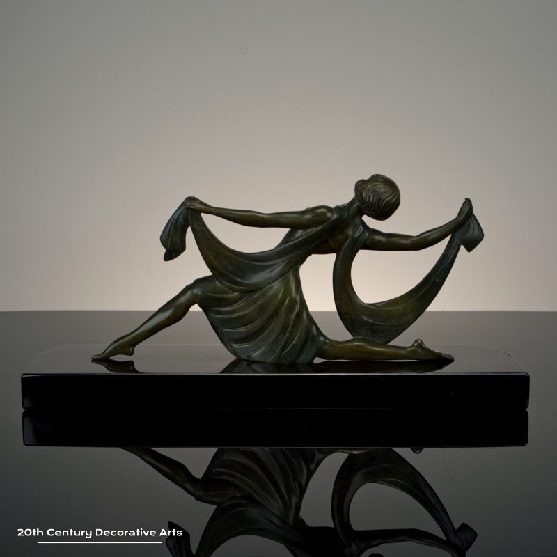  Jean Lormier - A French Art Deco bronze sculpture, circa 1925 - featuring a young woman in a dancing pose, the bronze with an antiqued patina