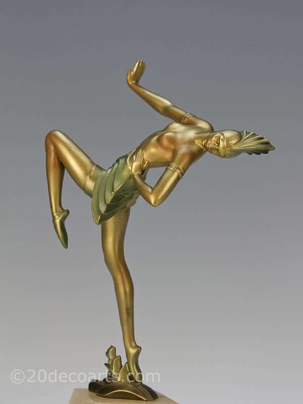  20th Century Decorative Arts |A very stylish Art Deco German spelter figure circa 1930, the female dancer in futuristic ballet costume, cold-painted gold and enamelled, mounted on a shaped alabaster base