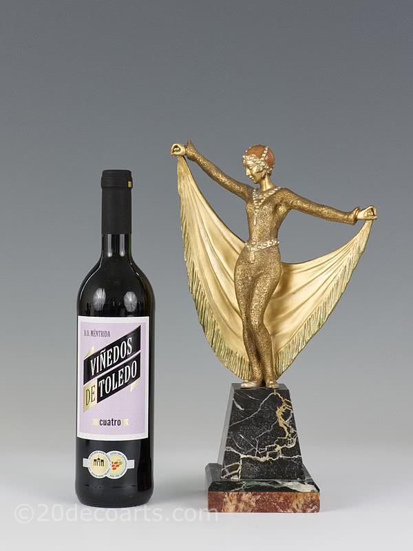  20th Century Decorative Arts |A rare Art Deco French bronze figure by Henri Désiré Grisard, circa 1925 depicting a cat-suited dancer with drape and a gilded and enamelled cold-painted finish, mounted on a shaped multi-marble base.
