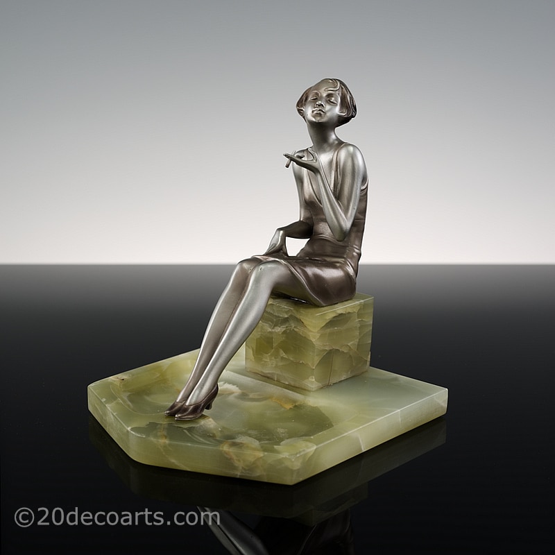   Josef Lorenzl - An Art Deco bronze figurine, Austria circa 1930, the modern miss smoking a cigarette 1 