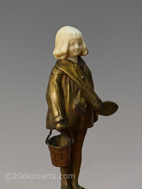   Solange Bertrand- An art deco bronze and ivory figurine, France circa
              1925, 