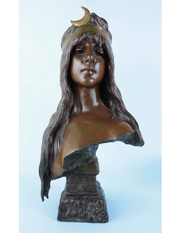  20th Century Decorative Arts | A large and stunning art nouveau French spelter bust by Emmanuel Villanis titled "Diane" circa 1900 the young woman with a serene gaze, the spelter with a bronze finish